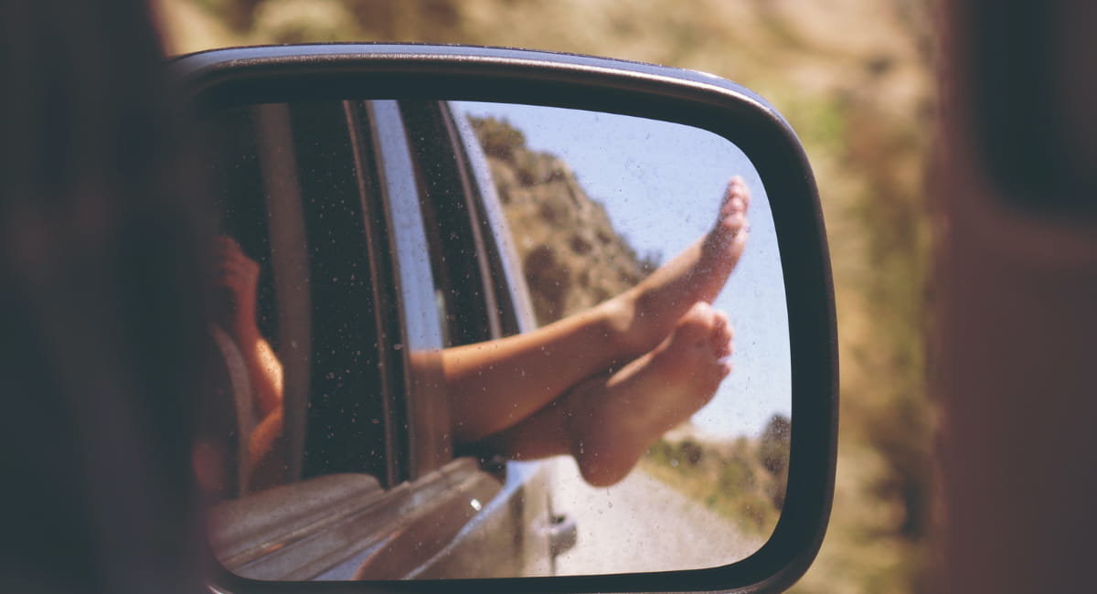 Road Trip with Feet in Rear View Mirror - Date Ideas Canada