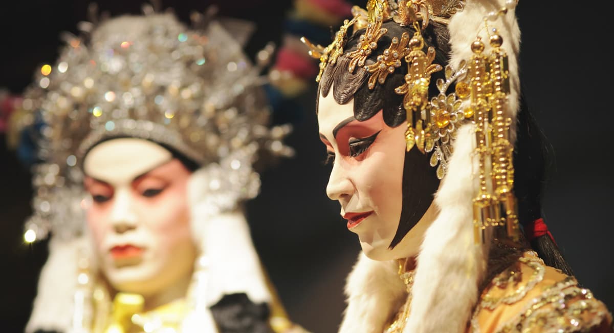 Two Actors on Stage in Full Costume