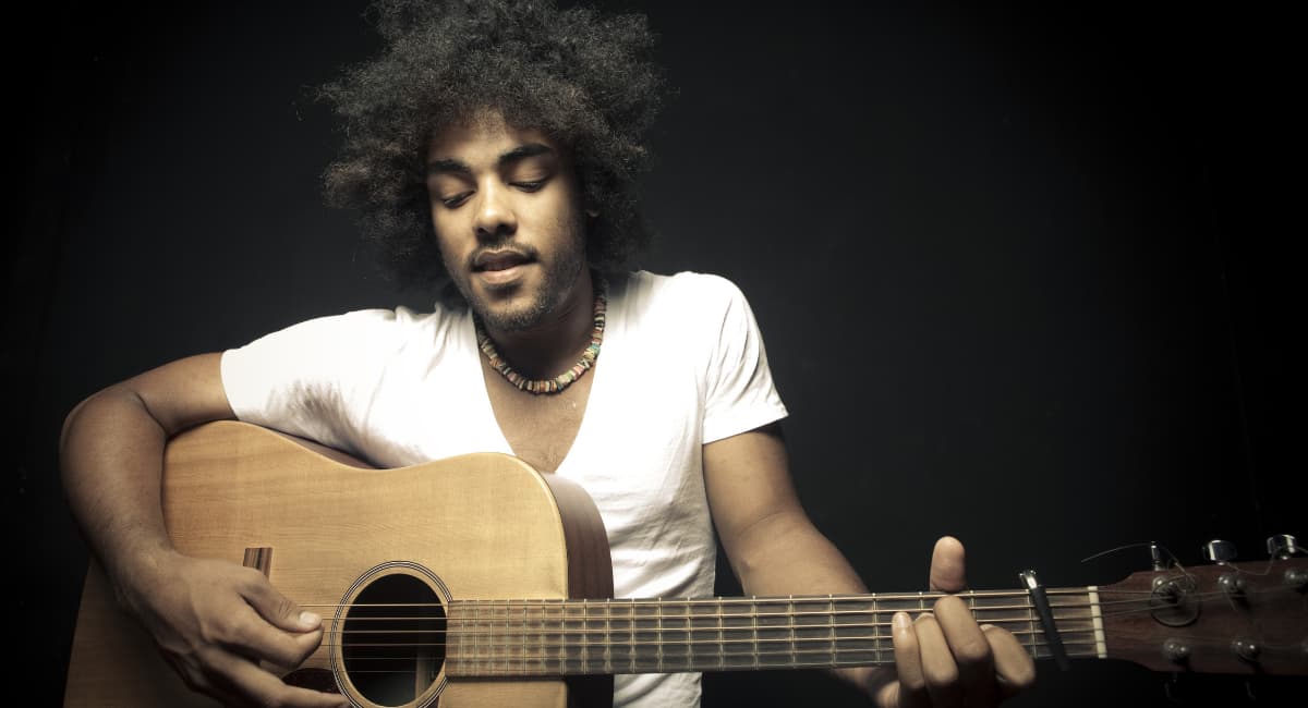 Guy Playing A Guitar