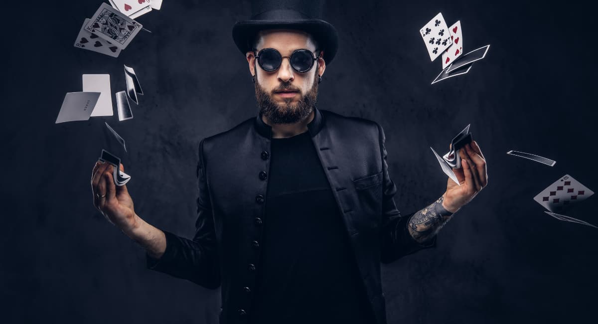 Magician with Playing Cards Flying Up Out of His Hands