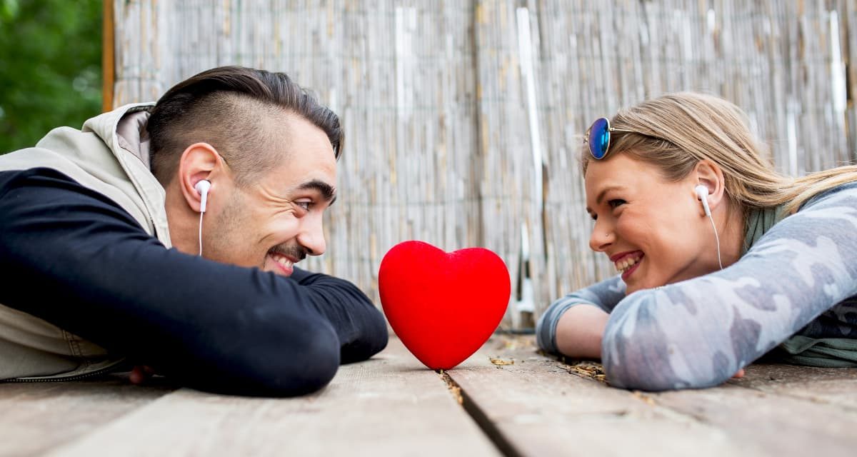 https://dateideascanada.com/wp-content/uploads/2021/02/Couple-Listening-to-Music-Over-Heart-Feature-Image-1200x640.jpg